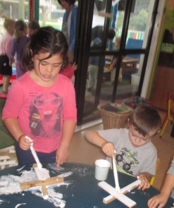 Children painting crosses